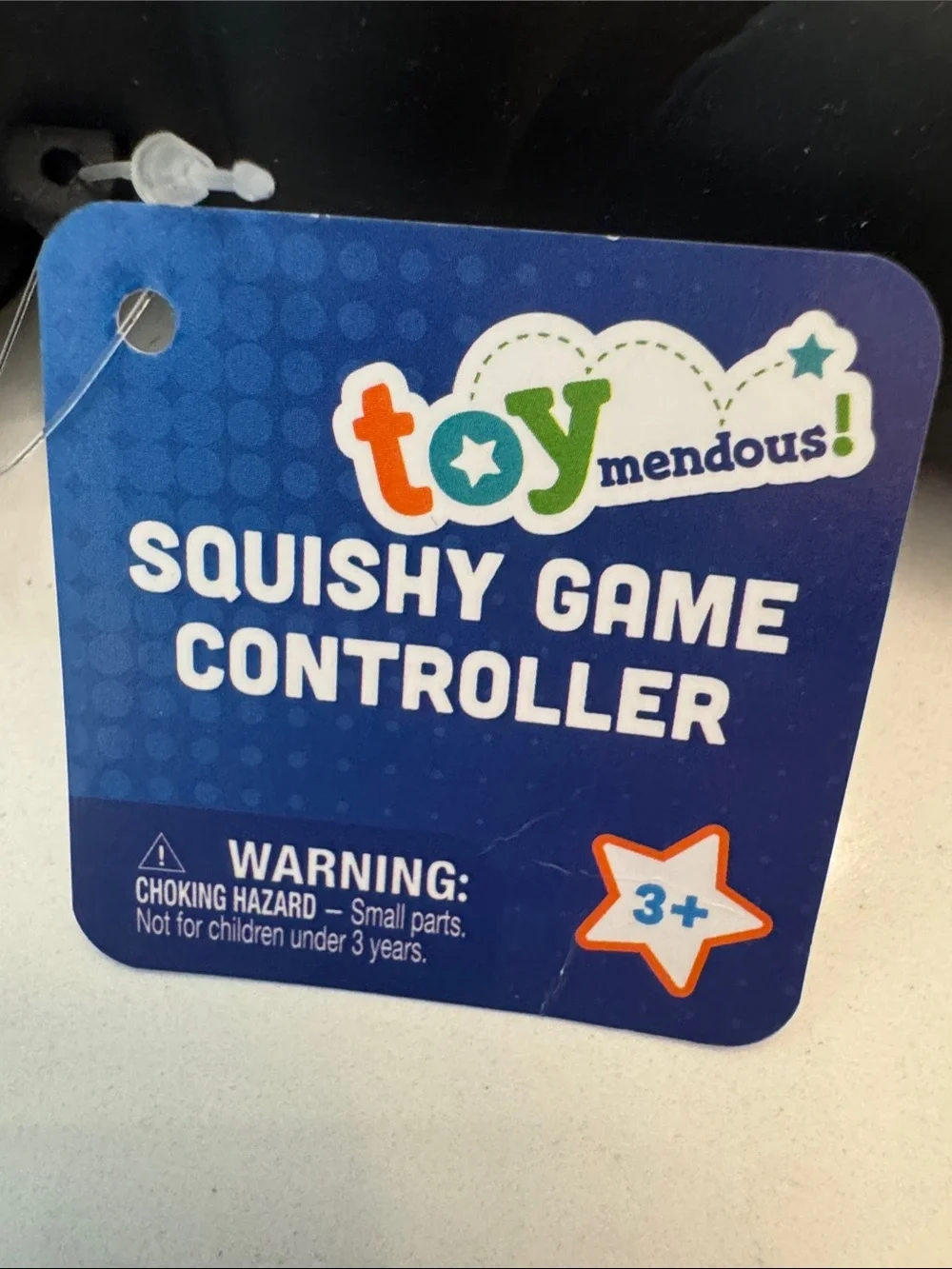 Black Squishy Game Controller Stress Toy with Green and Blue Buttons